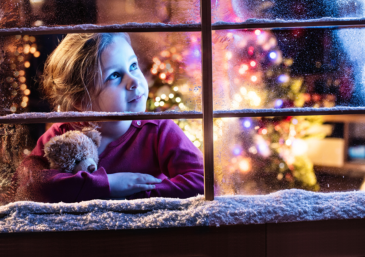 Girl looking out window